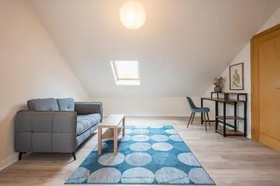 a living room with a couch and a table at Luxury Leiston 2 bed 2 bath with parking in Leiston