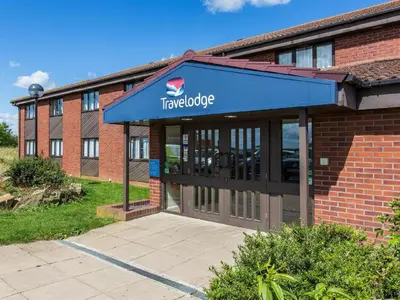 a travelodge sign on the front of a building at Travelodge Huntingdon Fenstanton in Fenstanton
