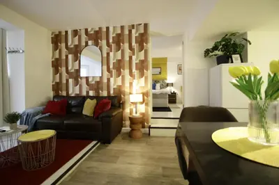 a living room with a couch and a table at Central Location Stylish 1-Bed Apartment Free Parking in Colchester