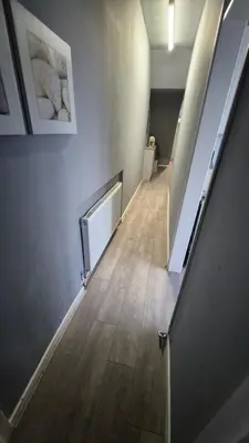 an empty hallway with a staircase in a building at Happy house in Southend-on-Sea