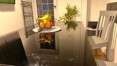 a bowl of bananas and oranges on a shelf in a kitchen at Serene Guest Room Retreat in Basildon with Private Entrance in Basildon