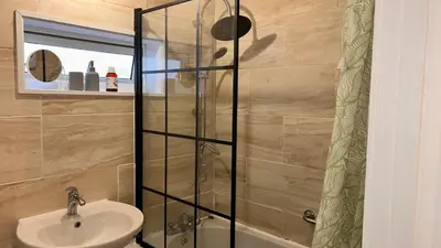 a bathroom with a sink and a shower at Serene Guest Room Retreat in Basildon with Private Entrance in Basildon