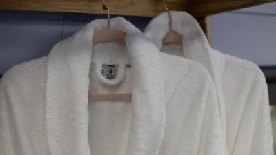 a group of towels hanging on a rack at The Carriage Ely in Coveney