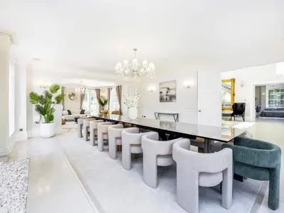 a dining room with a long table and chairs at The Essex Mansion - Uk48355 in Romford
