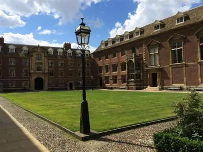 a street light in front of a large building at St Catharine's College, Cambridge in Cambridge