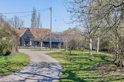 a path leading to a house in a park at 6 Bed in Ardleigh oc-b35089 in Ardleigh