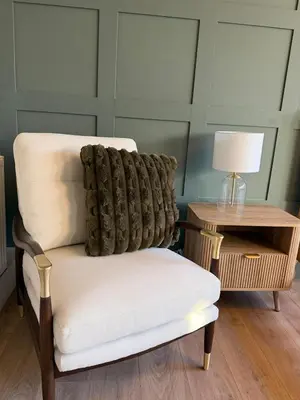 a chair with a pillow on it next to a table at NEW Gorgeous Boutique Country Getaway in Tuddenham
