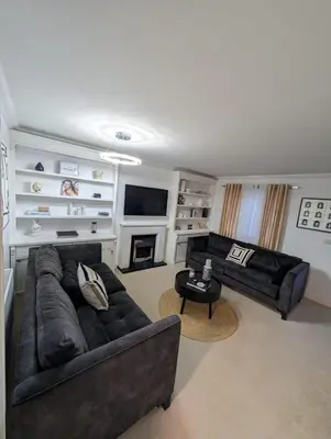 a living room with two couches and a television at Modern 3BR House I Garden I Cambridge I Parking x 2