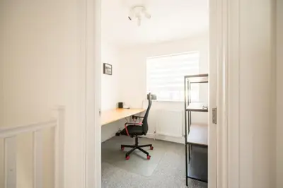 an office with a desk with a chair and a window at Modern 2-Bed Home in Leiston in Leiston