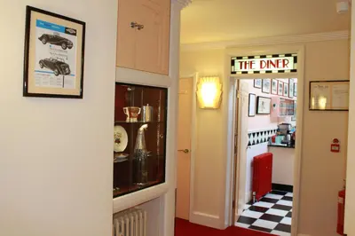 a hallway with a sign that reads the dvr at The PitStop in Bishops Stortford