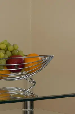 a bowl of fruit on top of a glass table at Citystay Living - Dove House in Cambridge