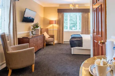 a hotel room with a bed and a desk at The Park Hotel - Sure Hotel Collection by Best Western in Diss