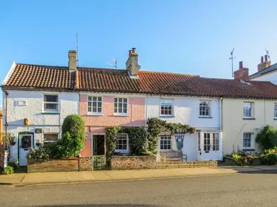 a large white house on the side of a street at Ivy Cottage in Aldeburgh