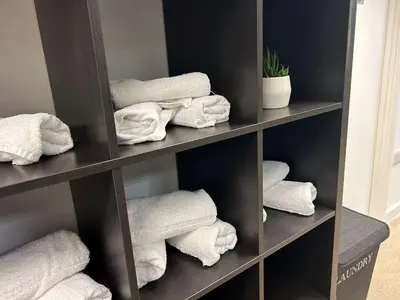 a shelf filled with towels in a bathroom at The Palace Hotel in Southend-on-Sea