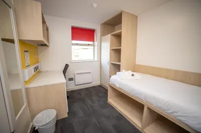 a small room with a bed and a window at University of Essex - Colchester Campus in Colchester