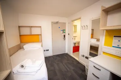 a small room with a bed and a sink at University of Essex - Colchester Campus in Colchester