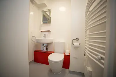 a bathroom with a white toilet and a sink at University of Essex - Colchester Campus in Colchester