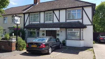a black car parked in front of a house at Aylesbray Lodge in Cambridge