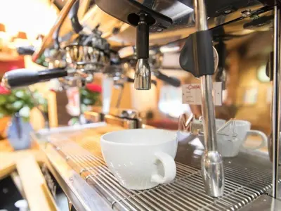 a coffee cup is sitting on a drying rack at The Rose and Crown in Thorpe le Soken