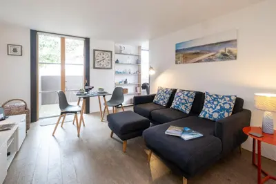 a living room with a couch and a table at Boat Lake in Thorpeness