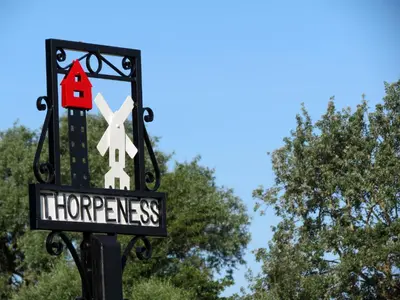 a sign for at 7 The Uplands in Thorpeness