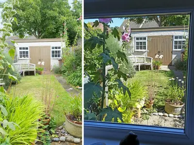 a view of a garden from a window at Walnut Cottage in Aldeburgh