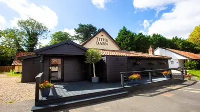 a building with a sign that reads the barn at Best Western Brome Grange Hotel in Brome