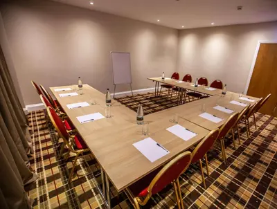 a large conference room with a long table and chairs at Best Western Brome Grange Hotel in Brome