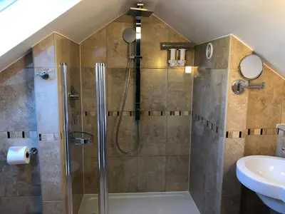 a bathroom with a shower and a sink at The Anchor Ely in Ely