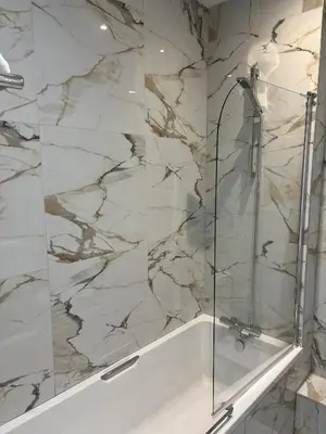 a bathroom with a shower with a glass door at Dolphin Hotel St Ives in St Ives