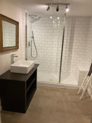 a bathroom with a sink and a shower at Private luxury retreat in Sible Hedingham