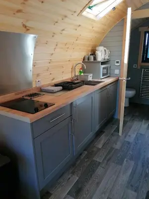 a kitchen with a sink and a counter top at Cosy Camping Suffolk in Ipswich