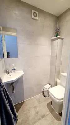 a bathroom with a toilet and a sink at Airport Reach in Southend-on-Sea