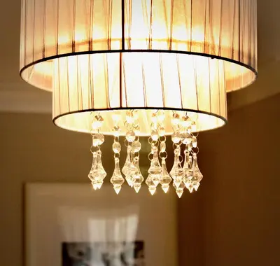 a chandelier hanging from the ceiling in a room at Mathus Gardens in Cambridge
