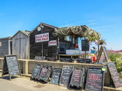 a fast food restaurant with signs in front of it at Drift In in Aldeburgh