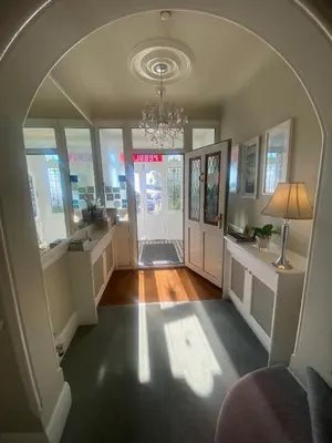 an arched hallway with an archway in a house at Pebbles Guest House in Southend-on-Sea
