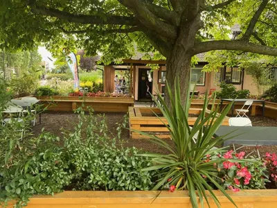 a garden in front of a house with flowers at Pebbles Guest House in Southend-on-Sea