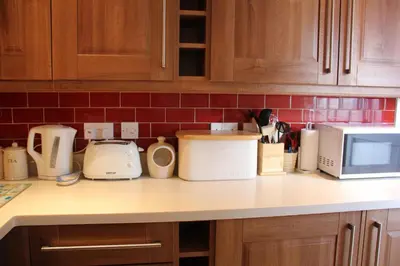 a kitchen counter with various appliances on it at Seaside Fisherman Cottage Aldeburgh in Aldeburgh