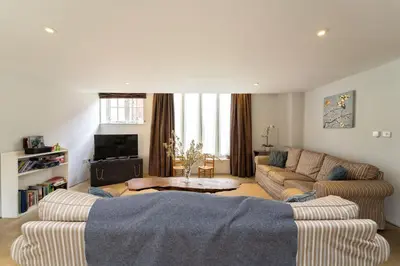 a living room with a couch and a table in it at Lodge Farm in Freston