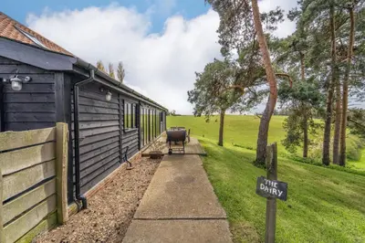 a house with a sign that reads guest house at Lodge Farm in Freston