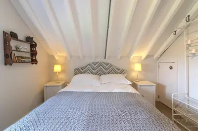 a bedroom with a large bed with two night stands at Lodge Farm in Freston