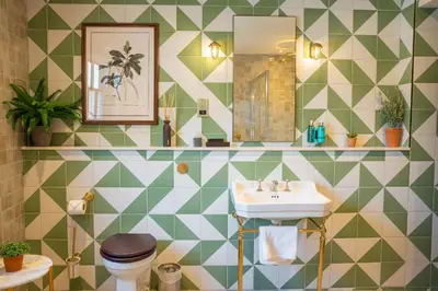 a bathroom with a sink and a toilet at Salisbury Arms Hotel in Hertford