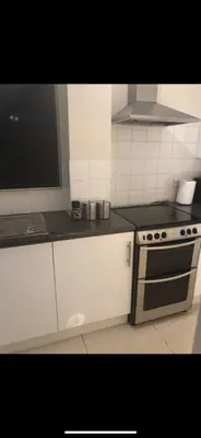 a kitchen with a stove and a counter top at Waltham Abbey Private Property in Waltham Abbey