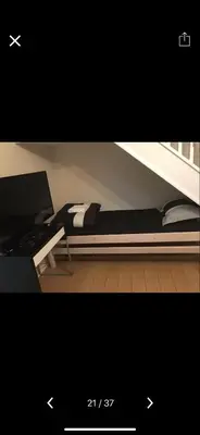 a bedroom with a bed with a desk and a laptop at Waltham Abbey Private Property in Waltham Abbey