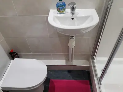 a bathroom with a sink and a toilet at Observation Court in Ipswich