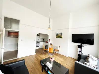 a living room with a couch and a table at On the Quay in Harwich