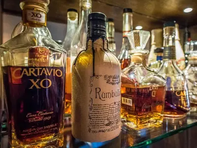a group of bottles of alcohol on a bar at The Royal Standard in Ely
