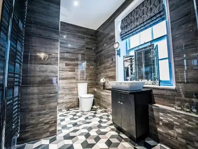 a bathroom with a sink and a toilet at The Royal Standard in Ely