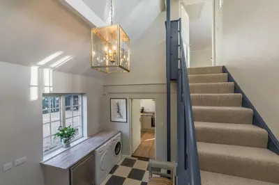 a staircase in a home with a stairwell at Marsh Lodge in Aldeburgh
