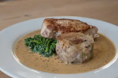 a plate of food with a piece of meat and broccoli at The Golden Key in Snape
